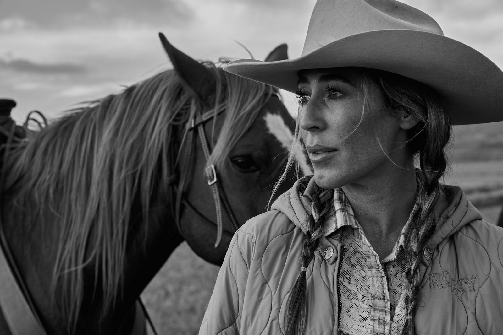 Annia Carter and her horse with sky in the background