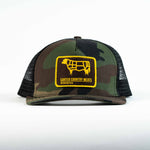 front view camo trucker cap with yellow and brown patch including cow outline and carter country meats wyoming usa