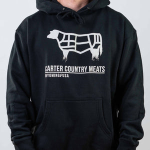 modeled front view black hoodie with white cow outline and white carter country meats wyoming usa text