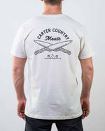 Rear Modeled view of white tee Carter Country meats text above two crossed knives with ten sleep in native american symbols below