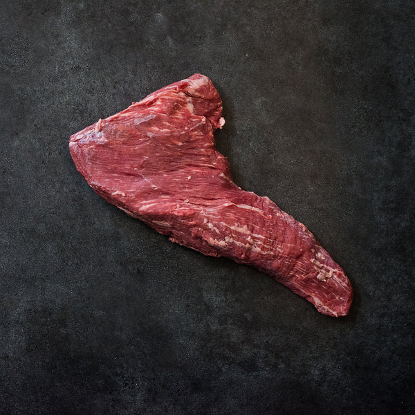 tri tip cut of beef steak on a slab
